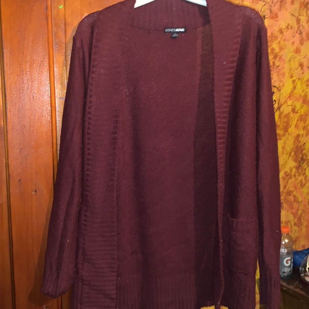 Maroon long sleeve cardigan with embroidered outline.